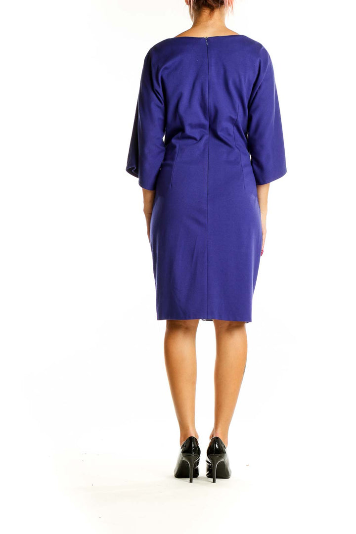 Back view of royal blue Taylor dress showing elegant silhouette