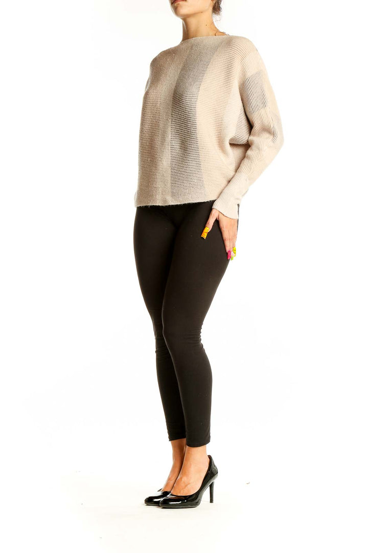 Front view of beige striped oversized knit sweater by Philosophy