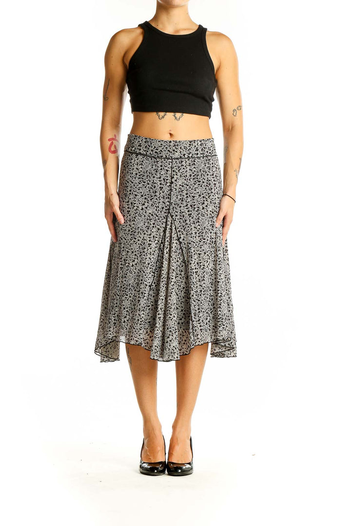 Front view of Max Studio black and white floral print midi skirt on model