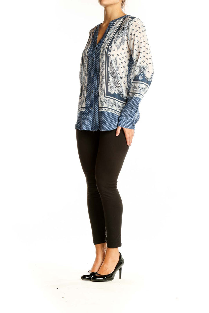 Front view of Ann Taylor blue and white patterned silk-cotton blouse with V-neck