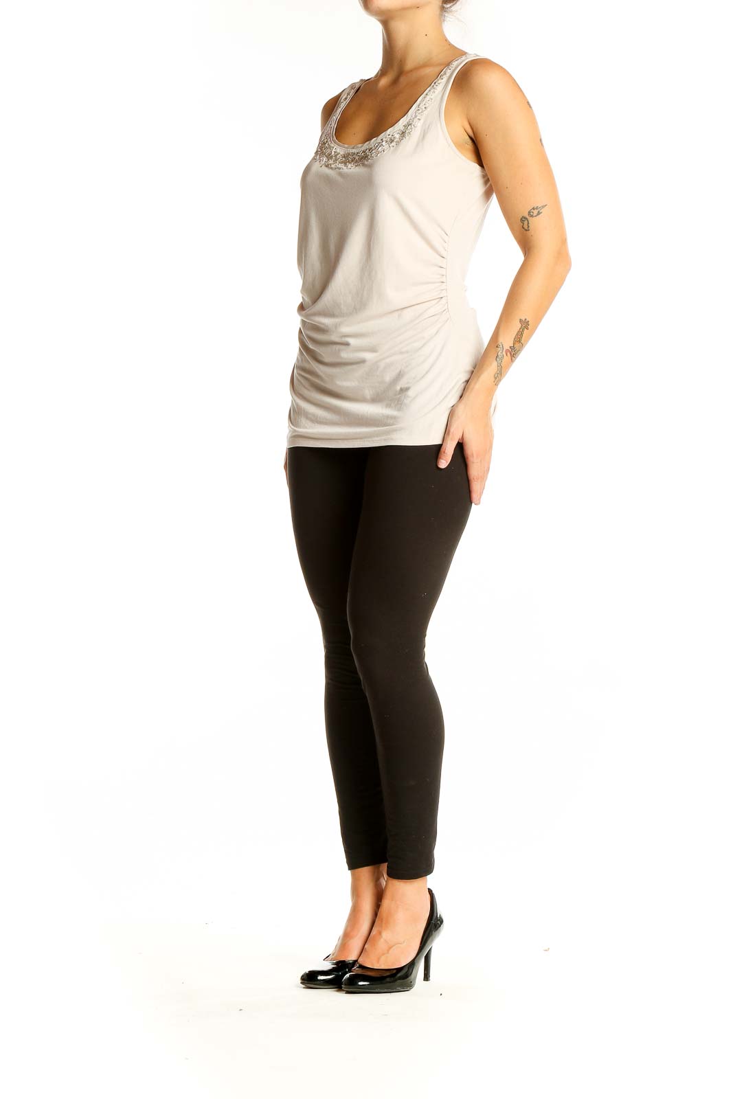 Front view of White House Black Market beige embellished sleeveless tank top