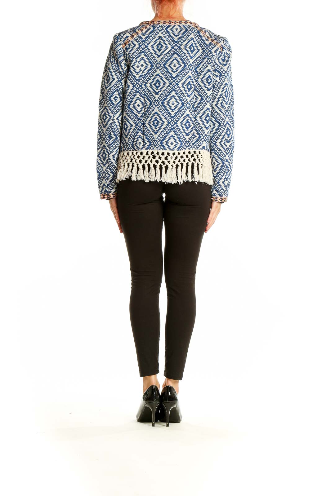 Side view of Tularosa blue geometric pattern jacket showing fringe detail