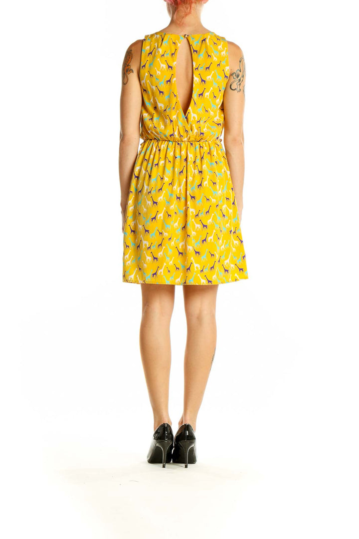 Side view of Yellow Giraffe Print Sleeveless Dress showing cinched waist