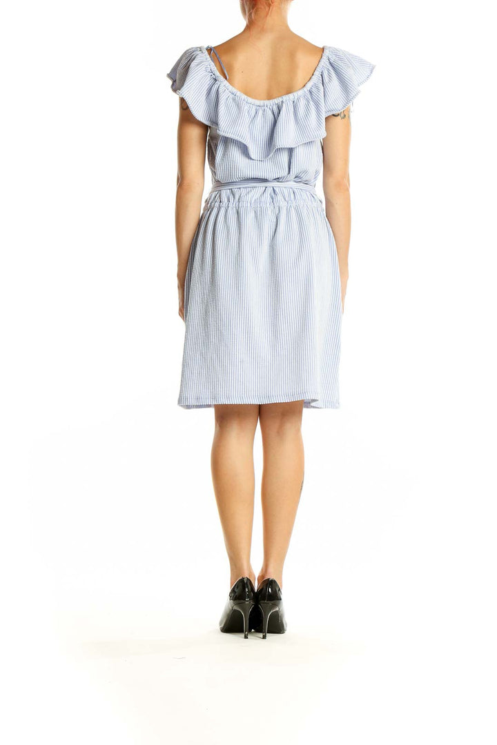 Back view of Michael Kors blue striped off-shoulder ruffle dress with tie waist