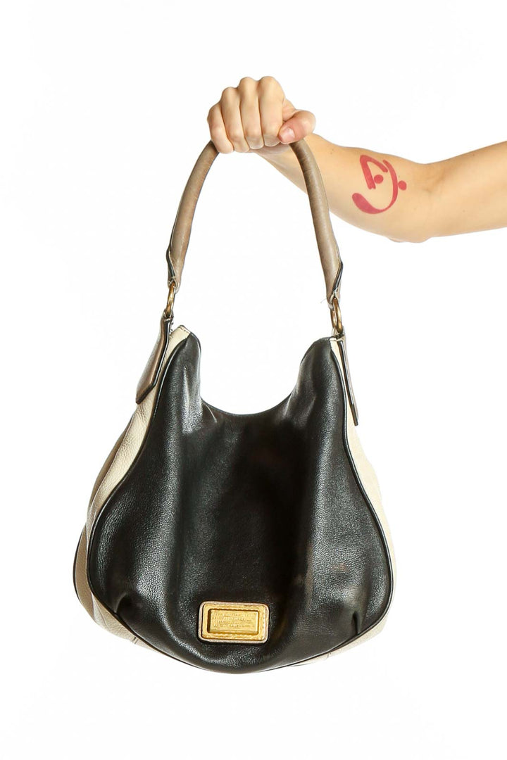 Front view of Coach black and beige two-tone hobo shoulder bag