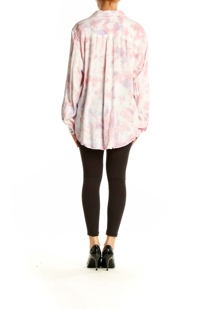 Back view of Torrid pink tie-dye rayon button-up shirt on model