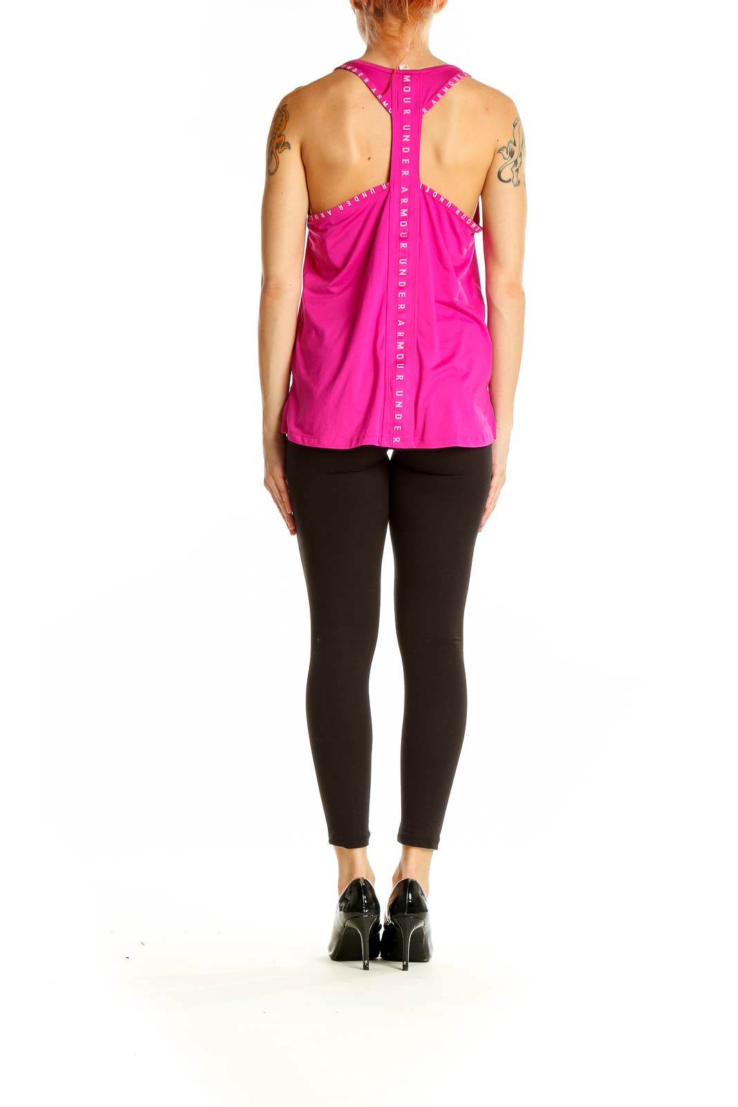 Back view of pink Under Armour racerback tank top showing longer hem and stylish design