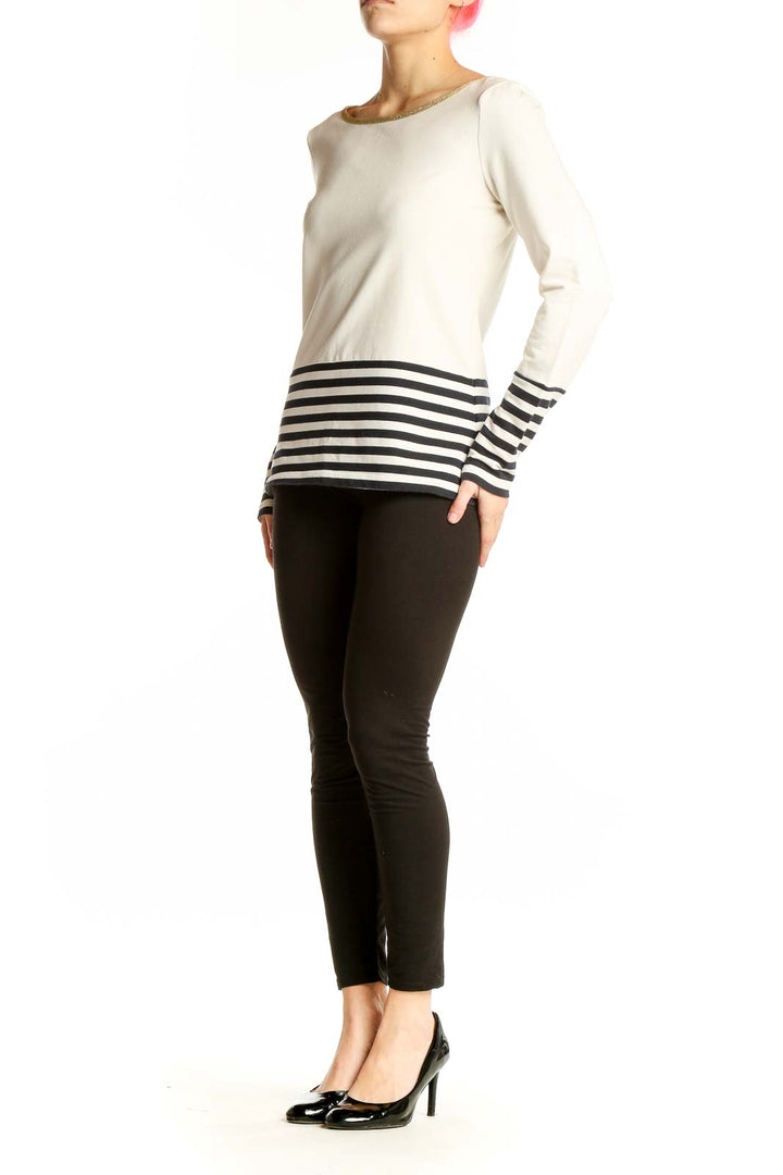 Front view of Banana Republic white top with black striped bottom