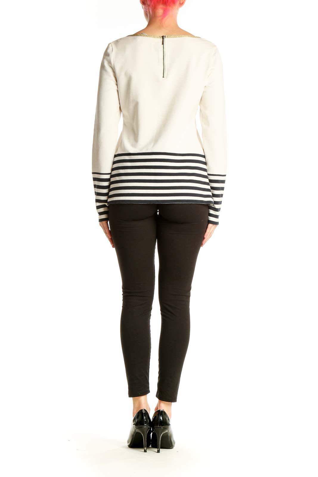 Side view of Banana Republic white and black striped top on model