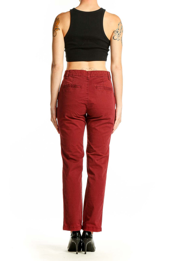 Back view of Gap red straight leg pants on model