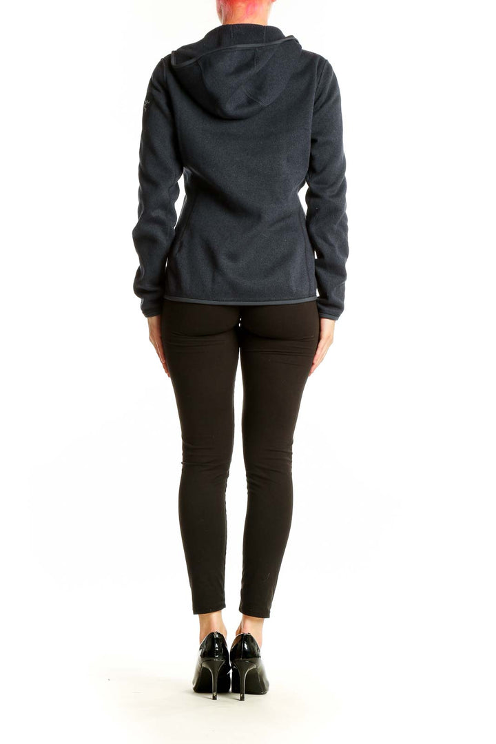 Side view of black Arc'teryx polyester fleece jacket on model