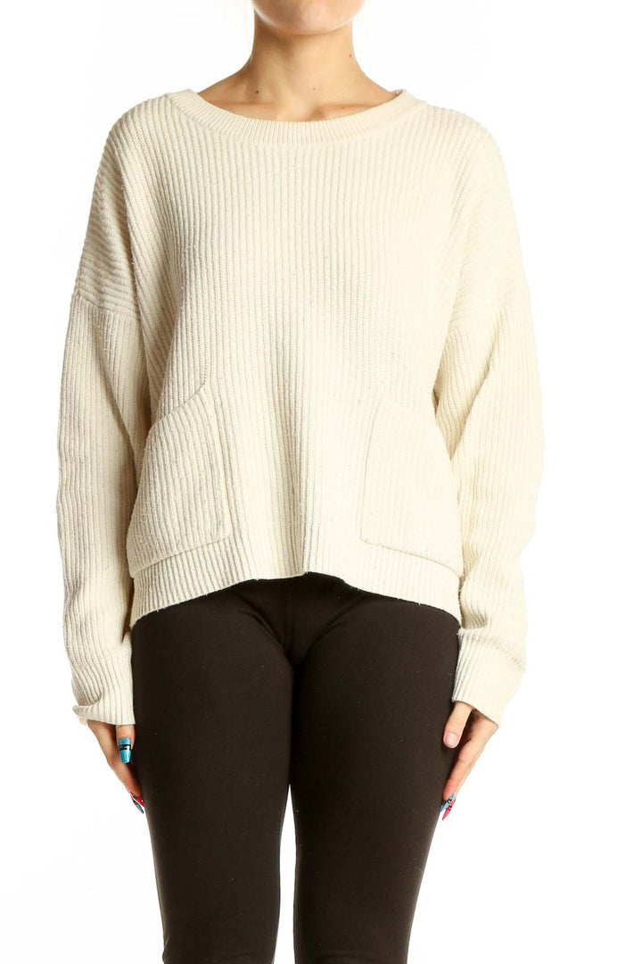 Front view of cream ribbed knit sweater with pockets from Madewell