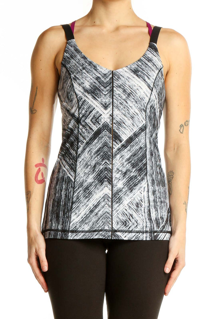 Front view of gray geometric print Lululemon athletic tank top with burgundy and black straps