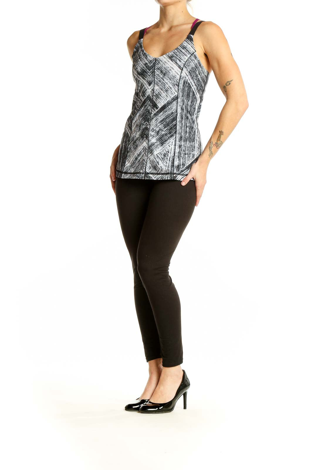 Front view of gray geometric print Lululemon athletic tank top with burgundy and black straps