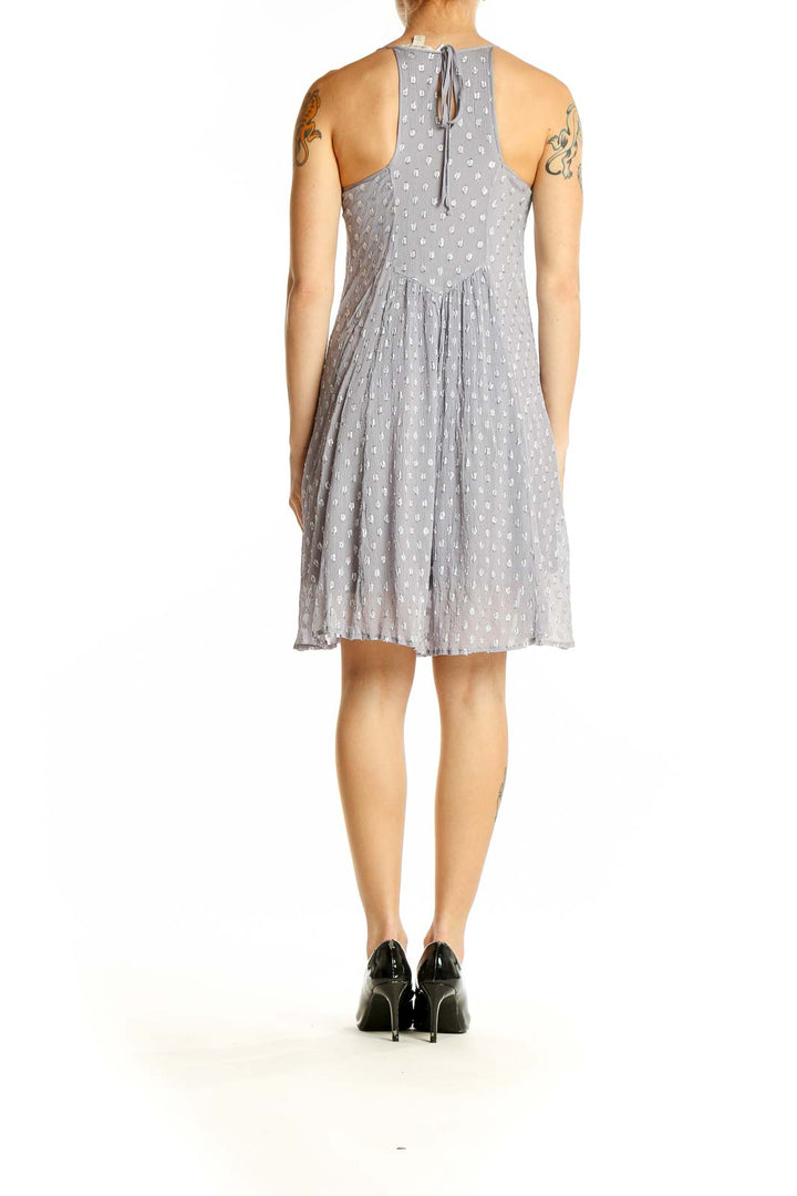 Side view of Ella Moss gray polka dot sleeveless summer dress showing flowy silhouette