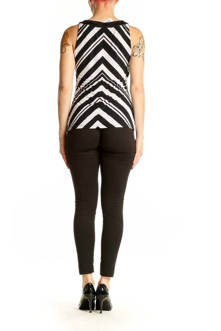 Side view of Black and White Chevron Sleeveless Top paired with black pants