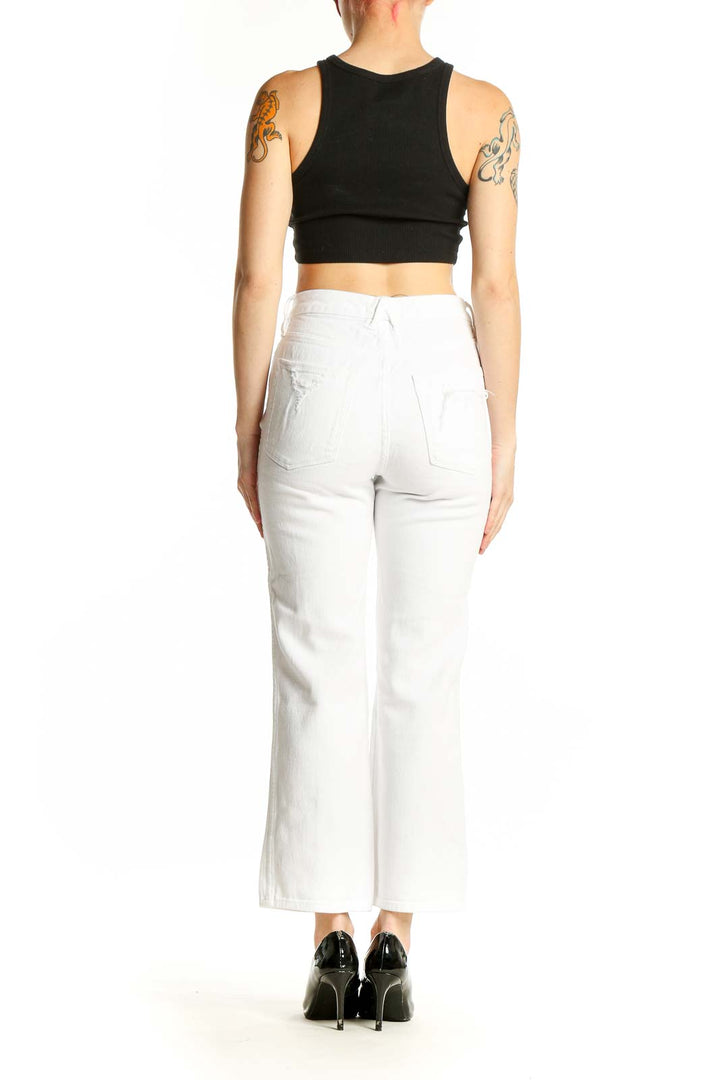 Back view of Good American white straight leg jeans with black crop top