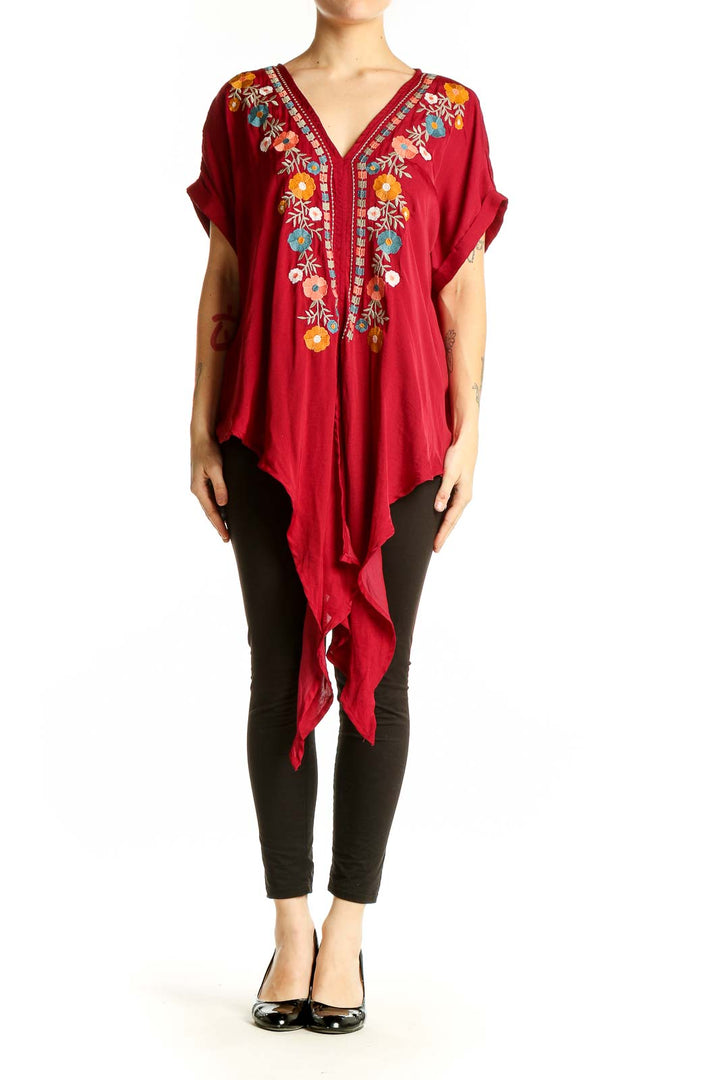 Front view of red Entro tunic top with colorful floral embroidery and V-neckline