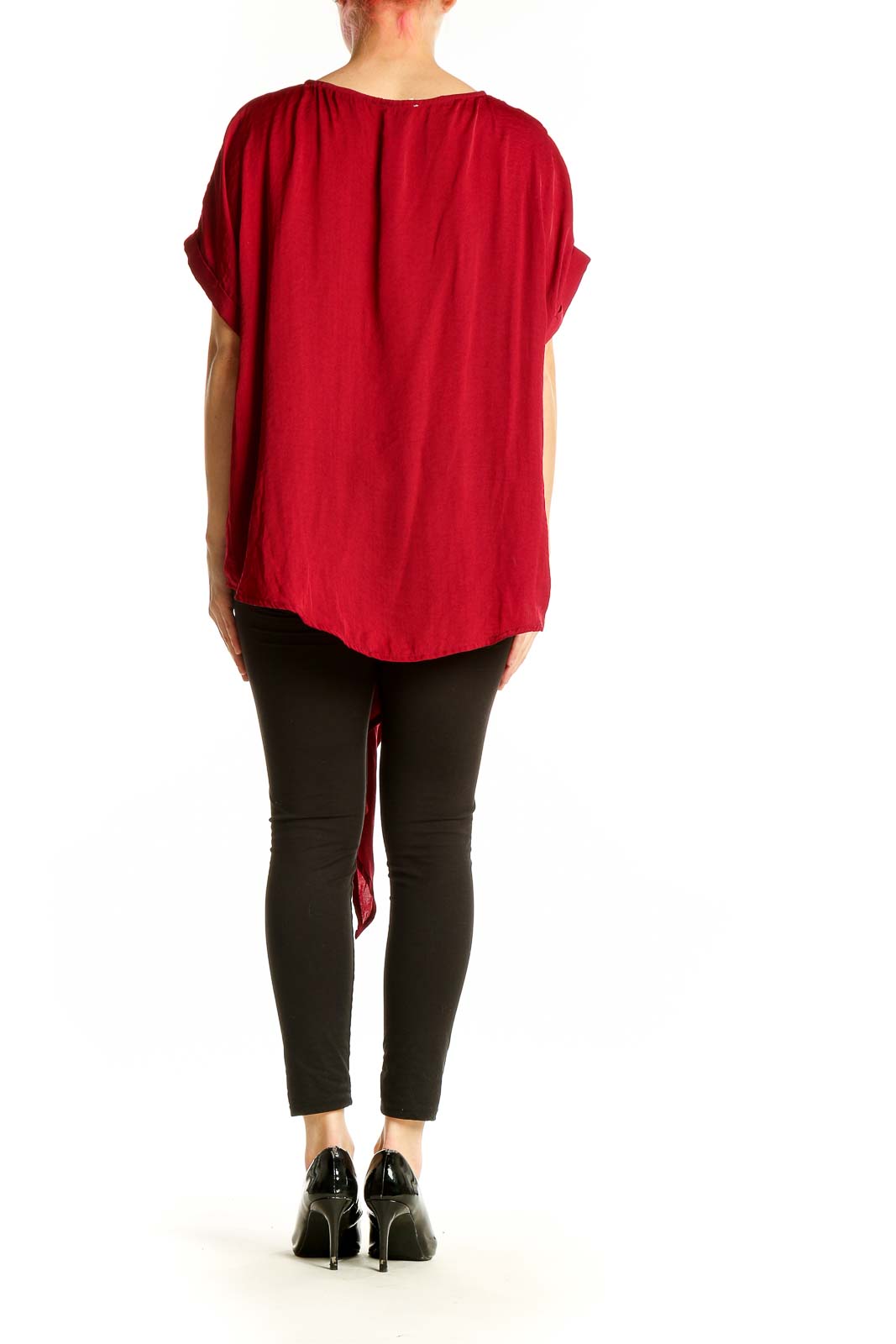 Side view of red Entro tunic top showing asymmetrical hemline and embroidery detail