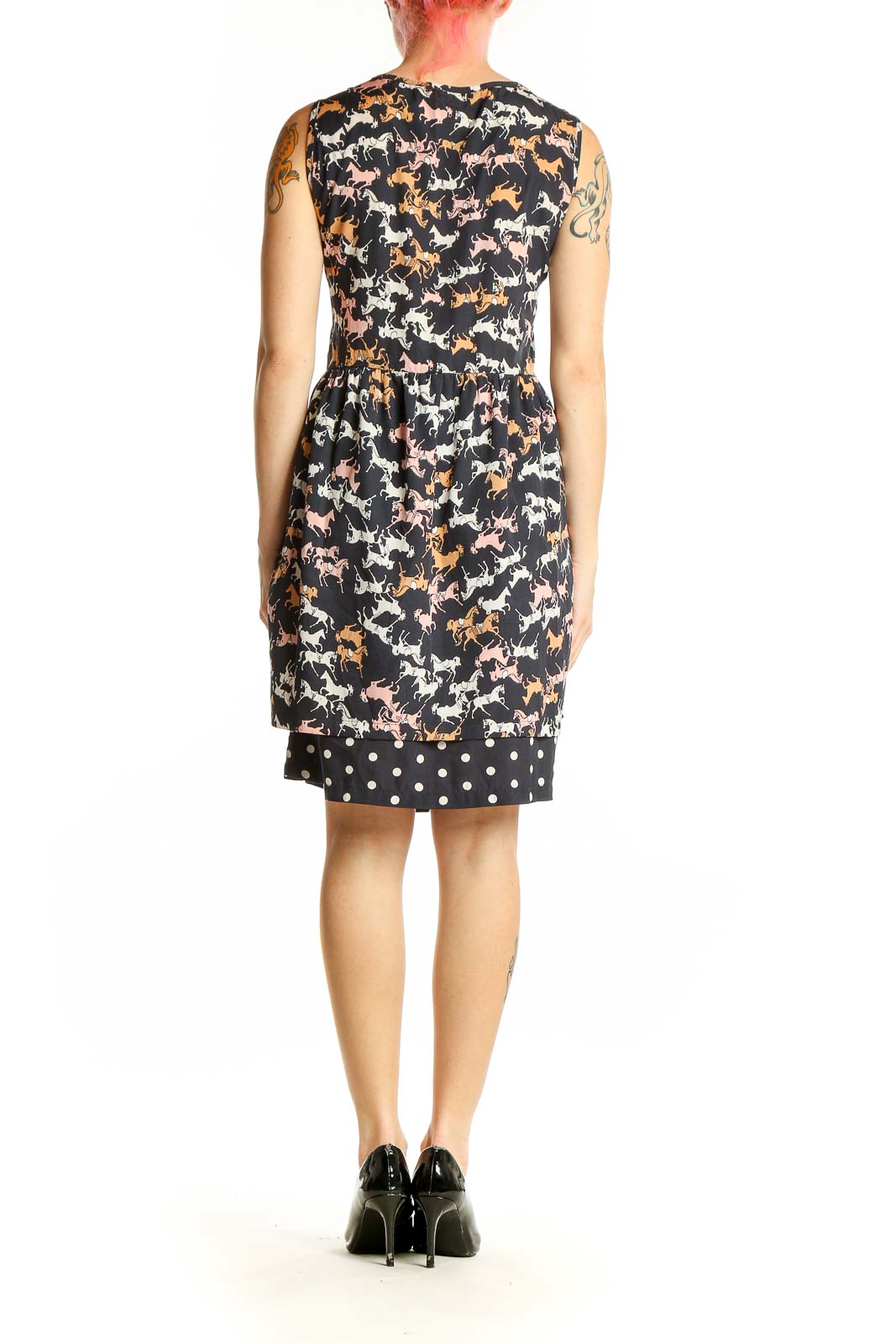 Side view of black Porridge dress showing horse print pattern and sleeveless design