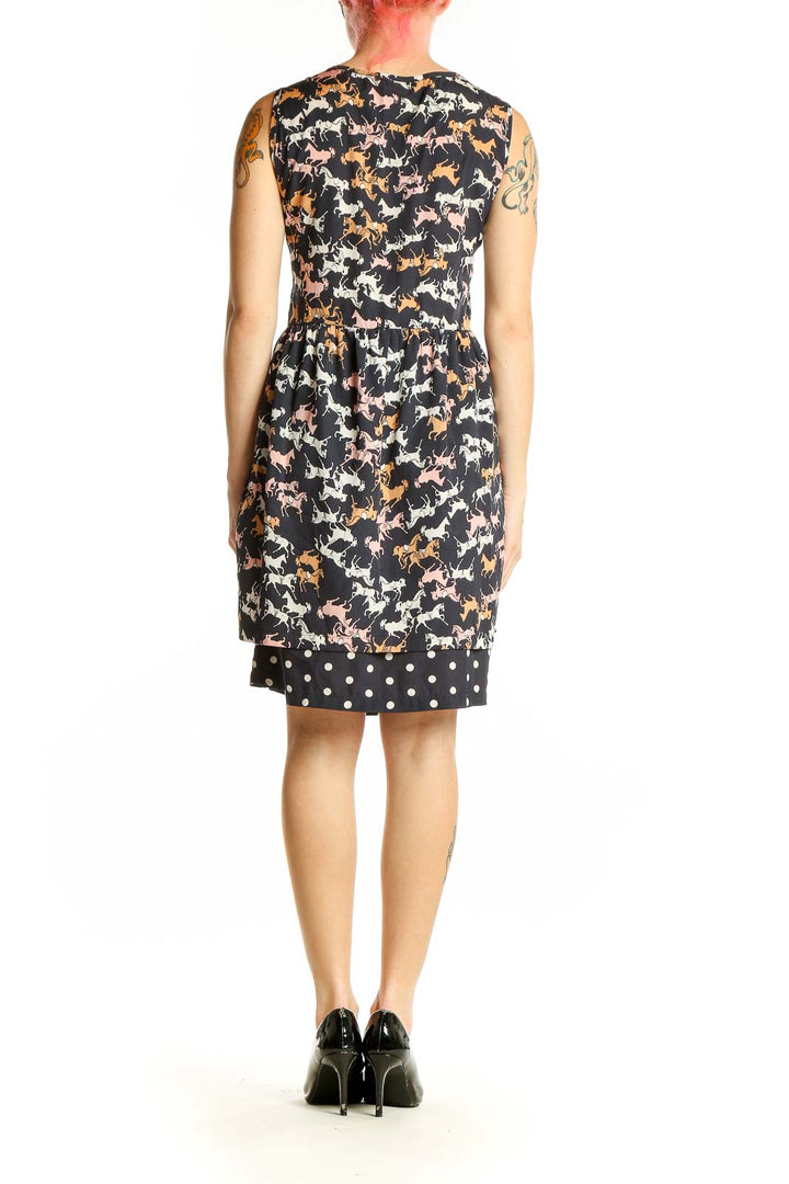 Side view of black Porridge dress showing horse print pattern and sleeveless design