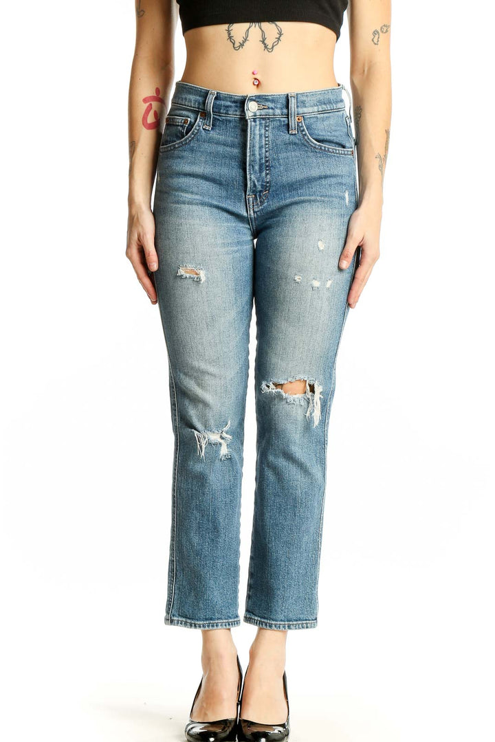 Front view of Lucky Brand light blue distressed cropped jeans on model
