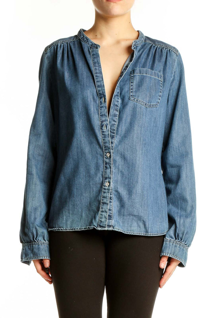 Front view of Kenar blue chambray button-up blouse with mandarin collar