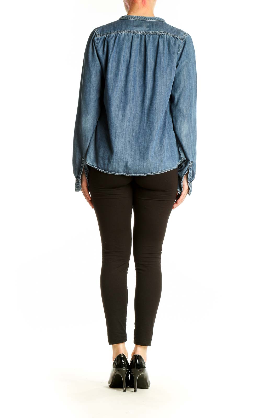 Back view of Kenar blue chambray button-up blouse showing relaxed fit
