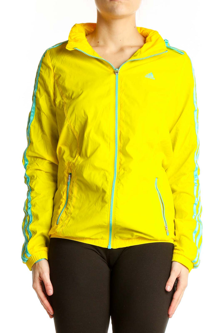 Front view of yellow Adidas athletic jacket with turquoise stripes