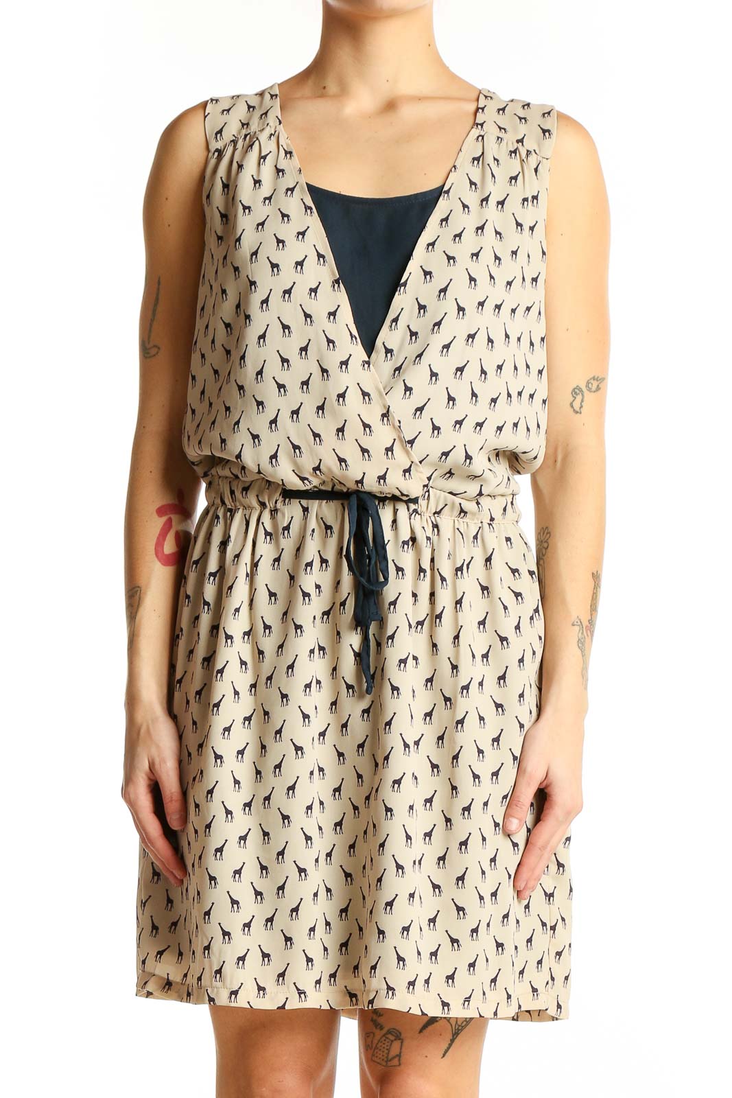 Front view of beige Promod sleeveless dress with giraffe print and wrap-style V-neck