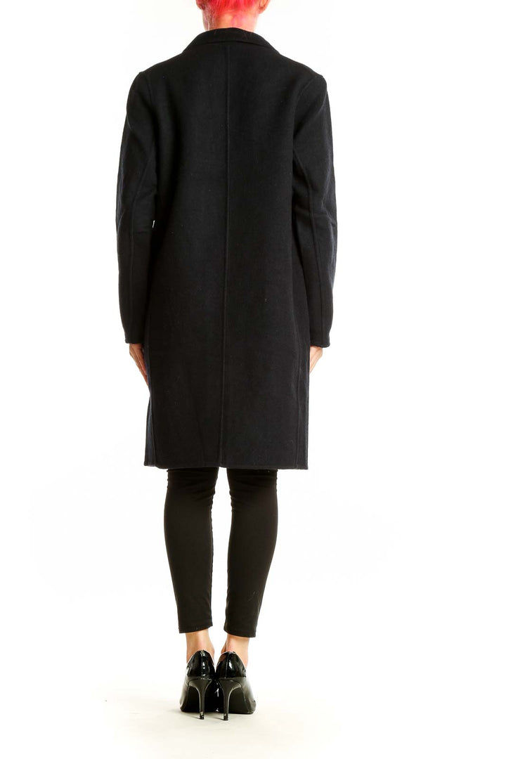 Side view of Comptoir des Cotonniers black wool blend long coat on model