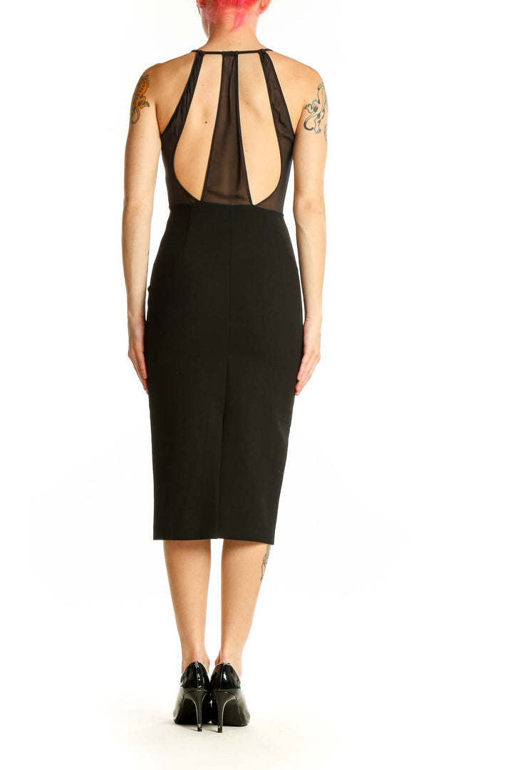 Side view of Zara Woman black bodycon midi dress showing figure-hugging silhouette