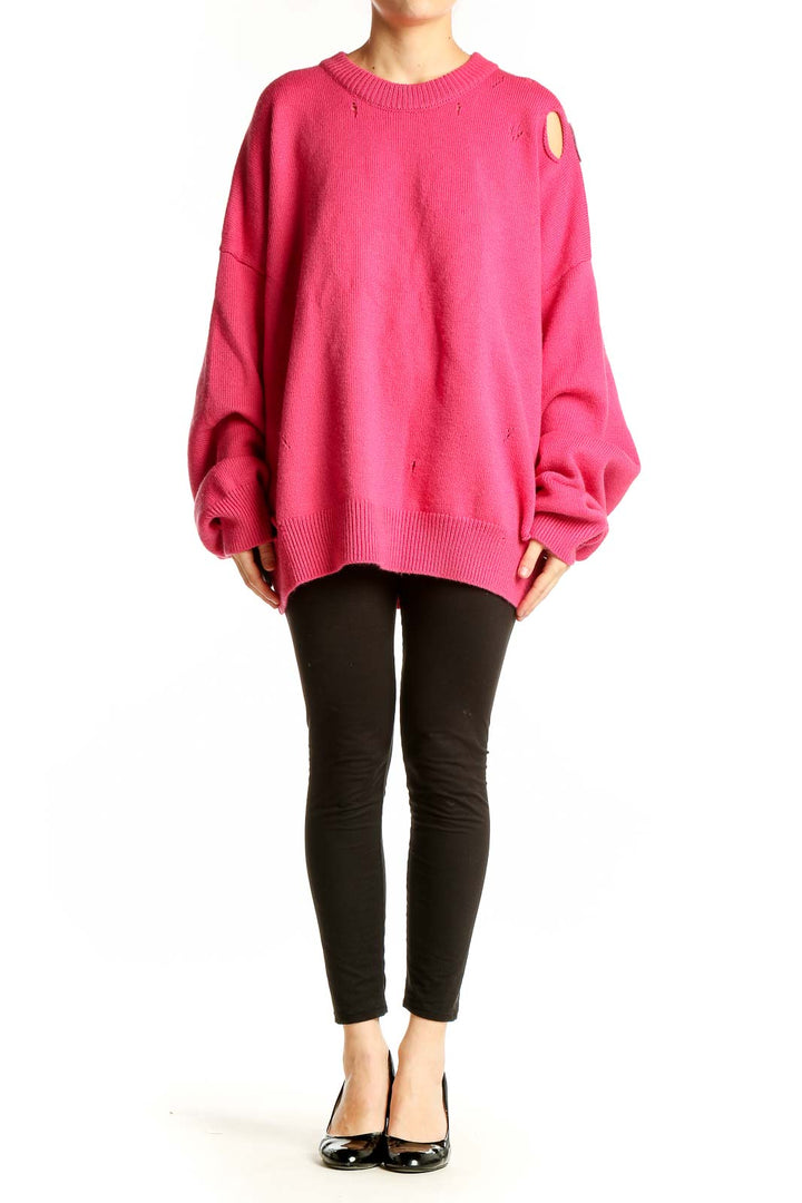 Front view of hot pink oversized distressed knit sweater by Ann Andelman