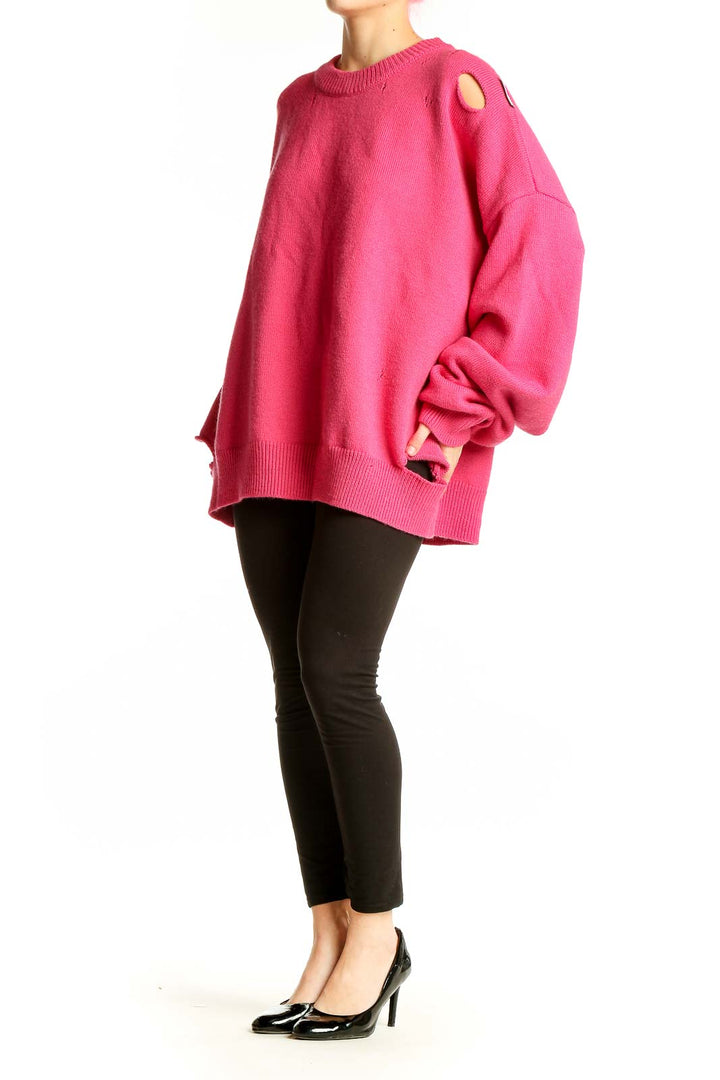 Front view of hot pink oversized distressed knit sweater by Ann Andelman
