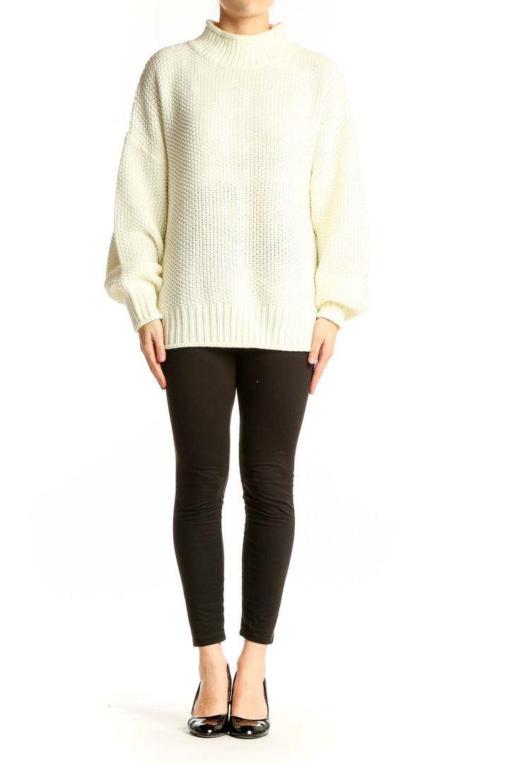 Front view of cream chunky knit mock neck sweater with balloon sleeves