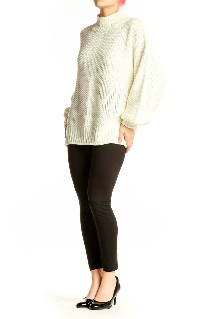 Front view of cream chunky knit mock neck sweater with balloon sleeves