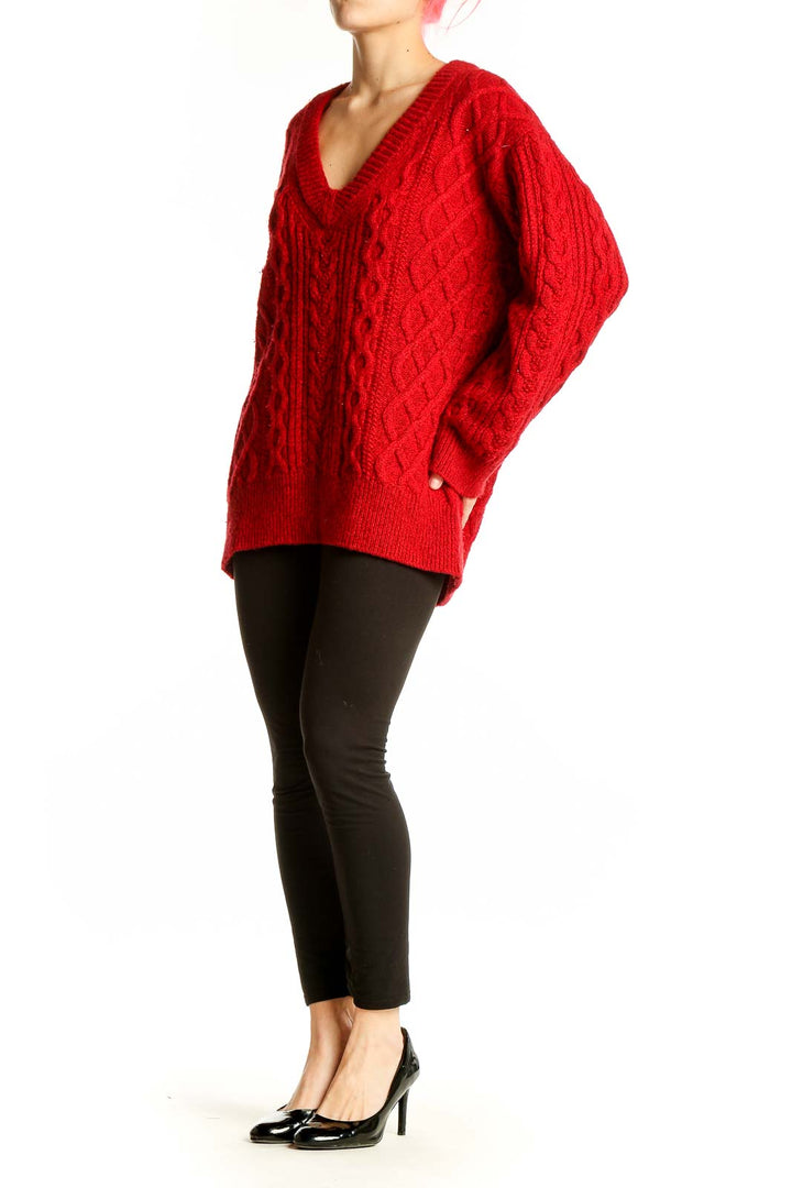 Front view of red cable knit V-neck sweater by Vince