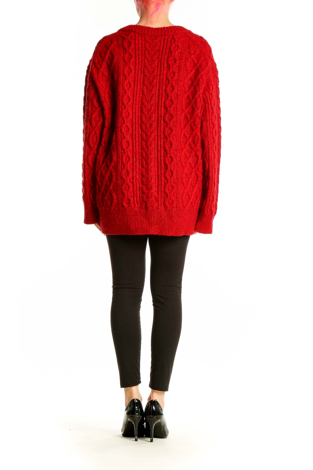 Side view of red cable knit V-neck sweater by Vince on model