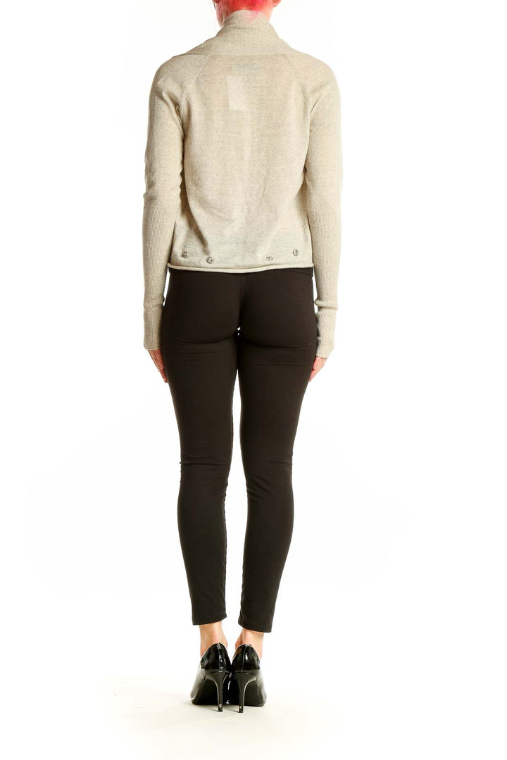 Side view of AllSaints beige Merino wool draped cardigan on model