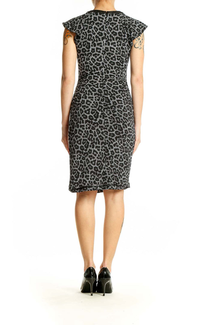 Side view of Michael Kors gray leopard print bodycon dress showing side slit