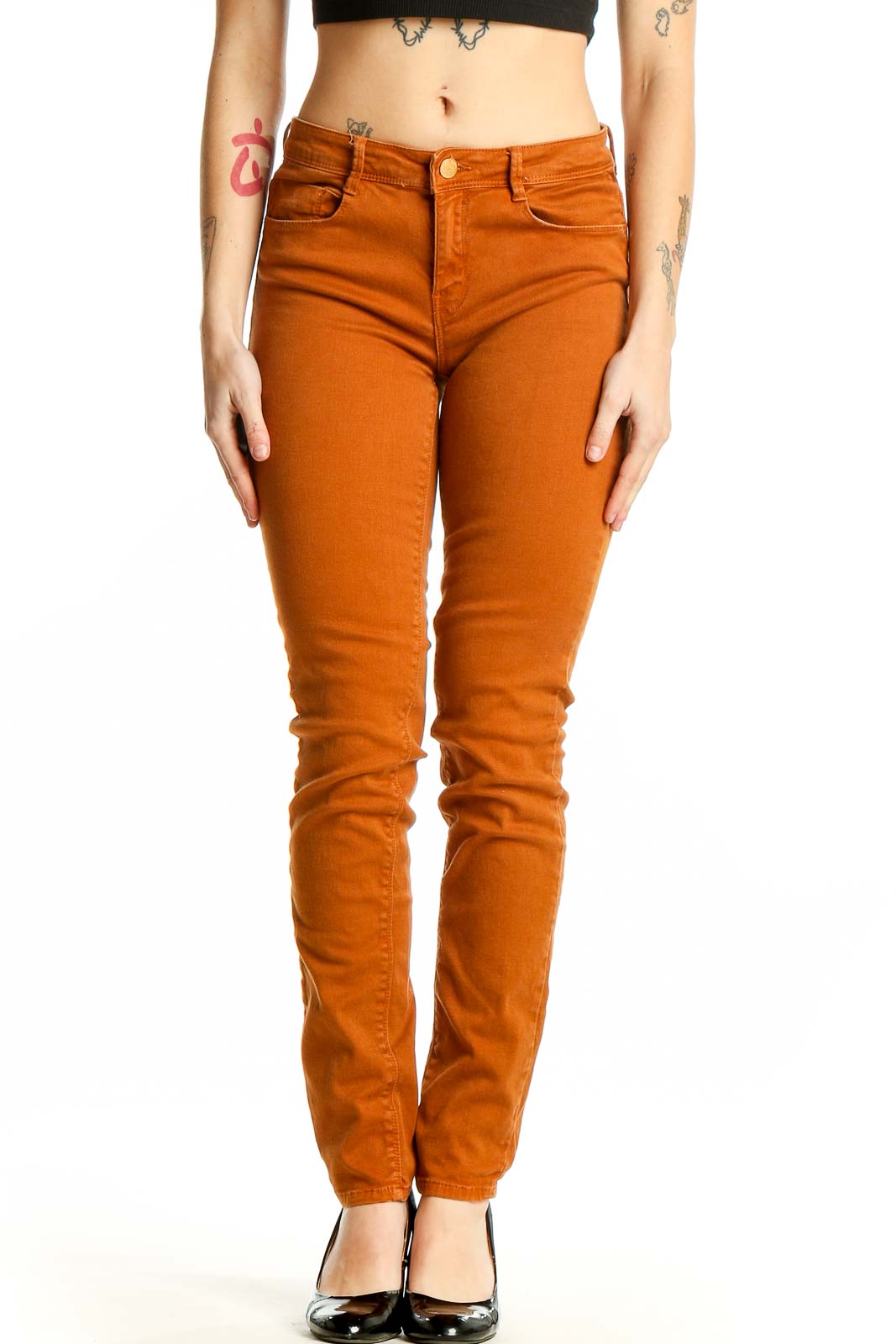 Front view of Zara Trafaluc rust orange skinny pants on model