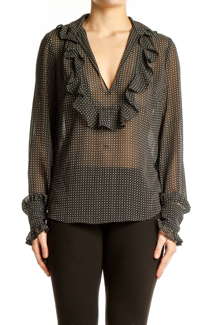 Front view of Ann Taylor LOFT black polka dot sheer blouse with ruffle detail