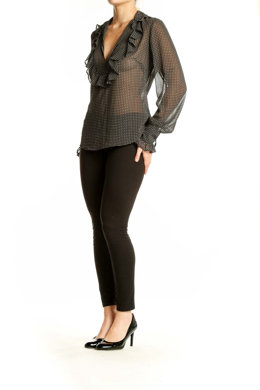 Front view of Ann Taylor LOFT black polka dot sheer blouse with ruffle detail