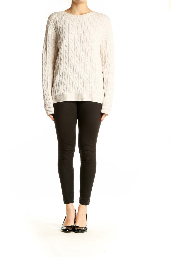 Front view of Croft & Barrow cream cable knit sweater on model
