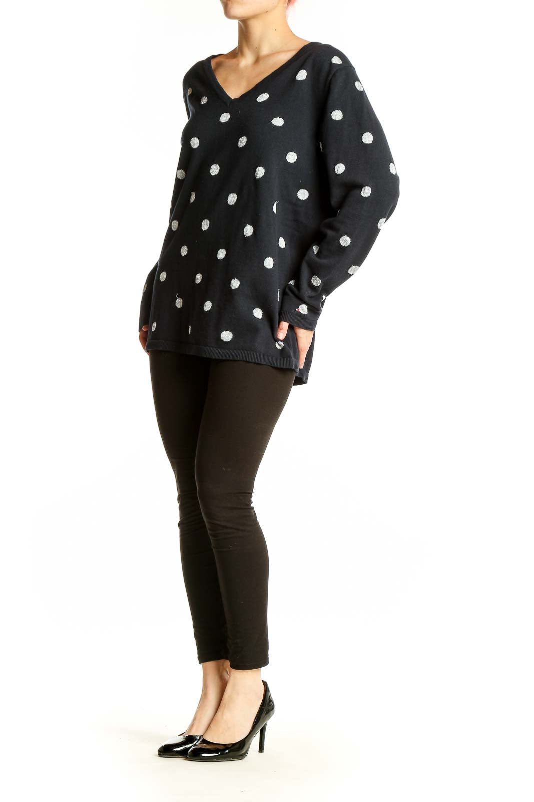 Front view of Tommy Hilfiger black V-neck sweater with white polka dots
