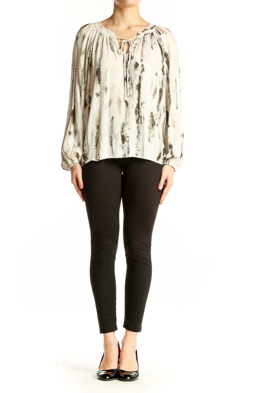 Front view of cream abstract print peasant blouse with tie neckline