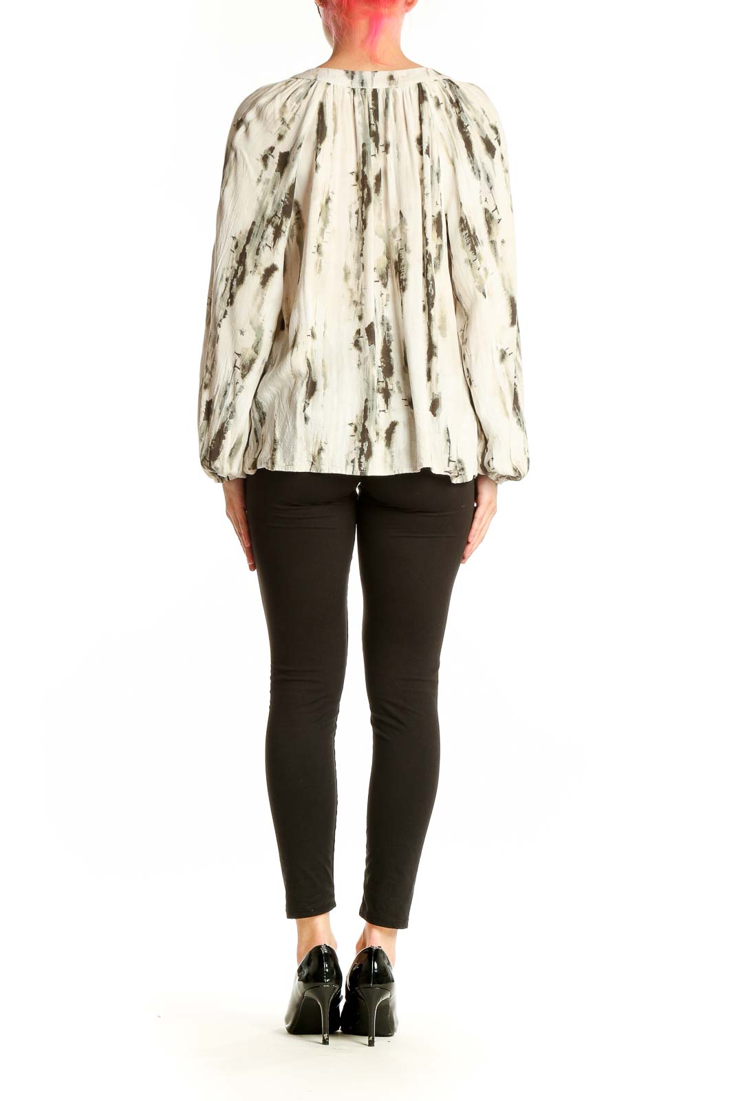 Side view of cream abstract print peasant blouse showing flowy silhouette
