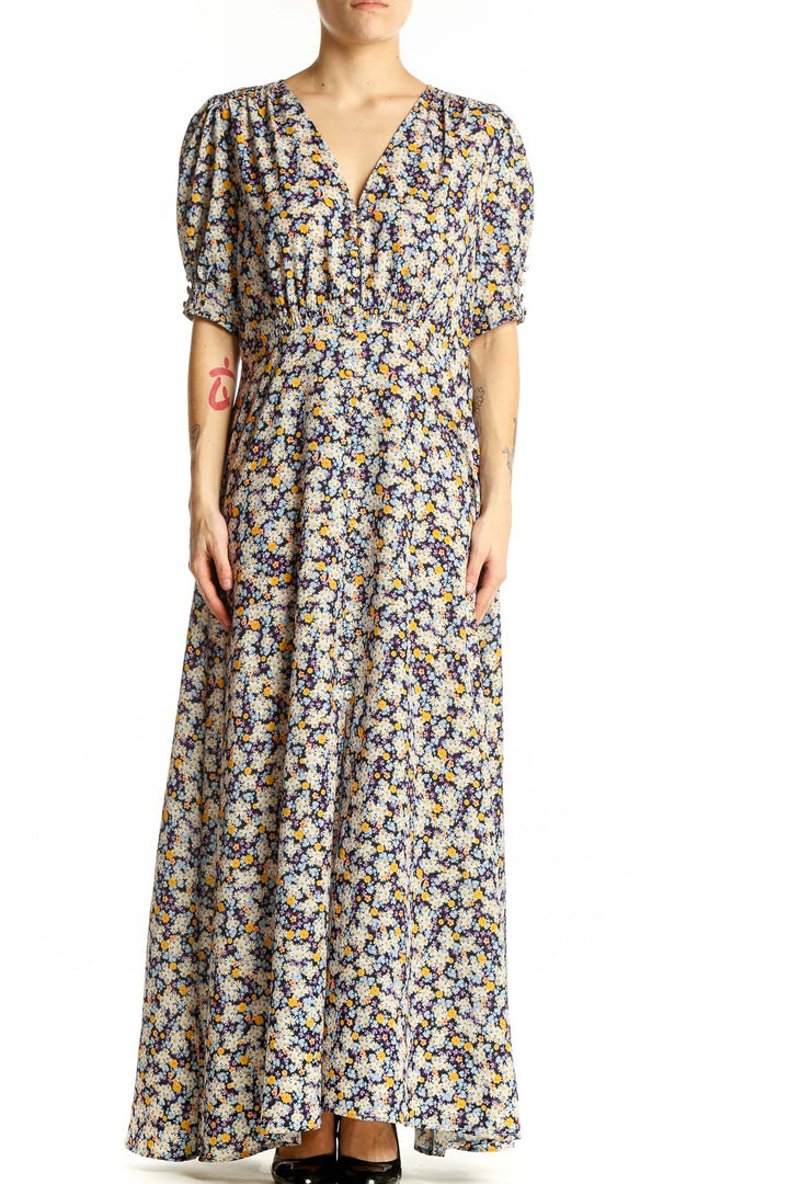 Front view of ROAM blue floral maxi dress with V-neck and puff sleeves