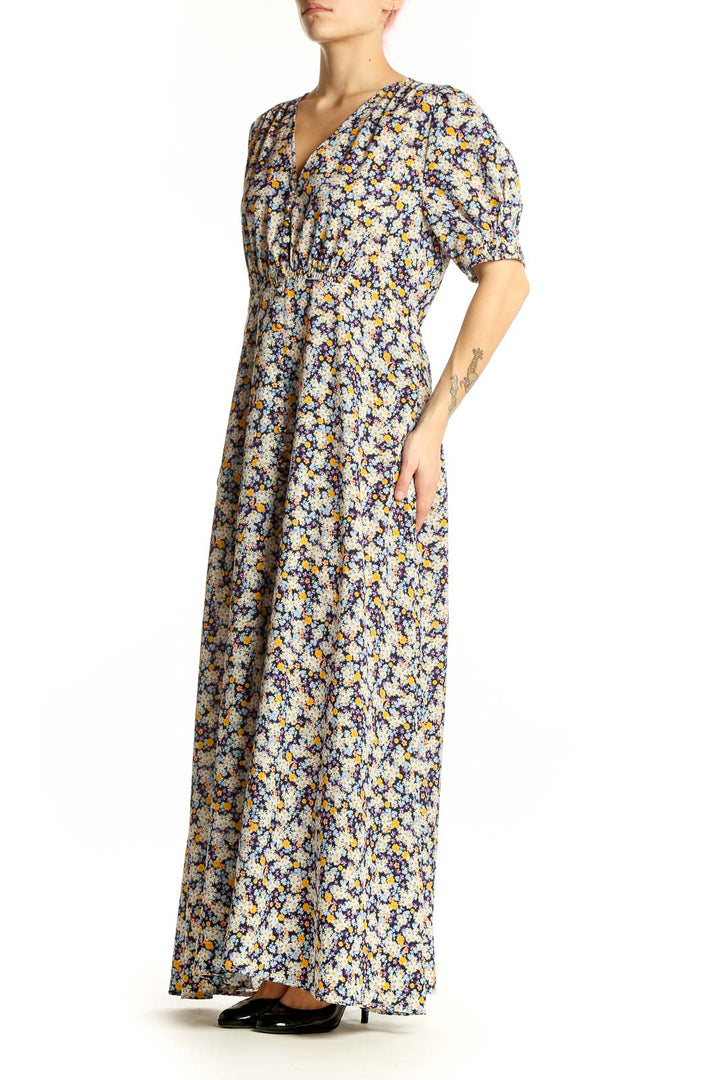 Front view of ROAM blue floral maxi dress with V-neck and puff sleeves