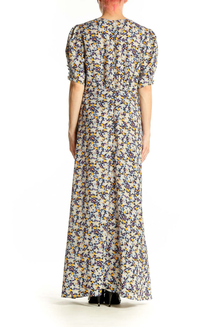 Side view of ROAM blue floral maxi dress showing flowing silhouette